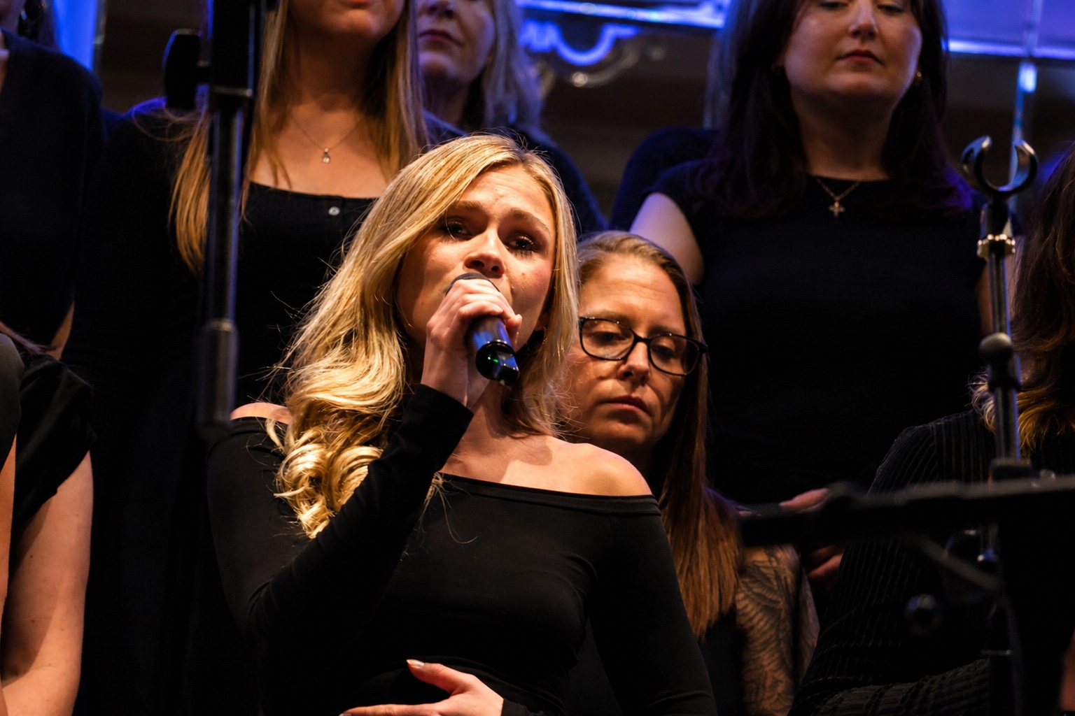 A SLYMI soloist singing at Club Langley