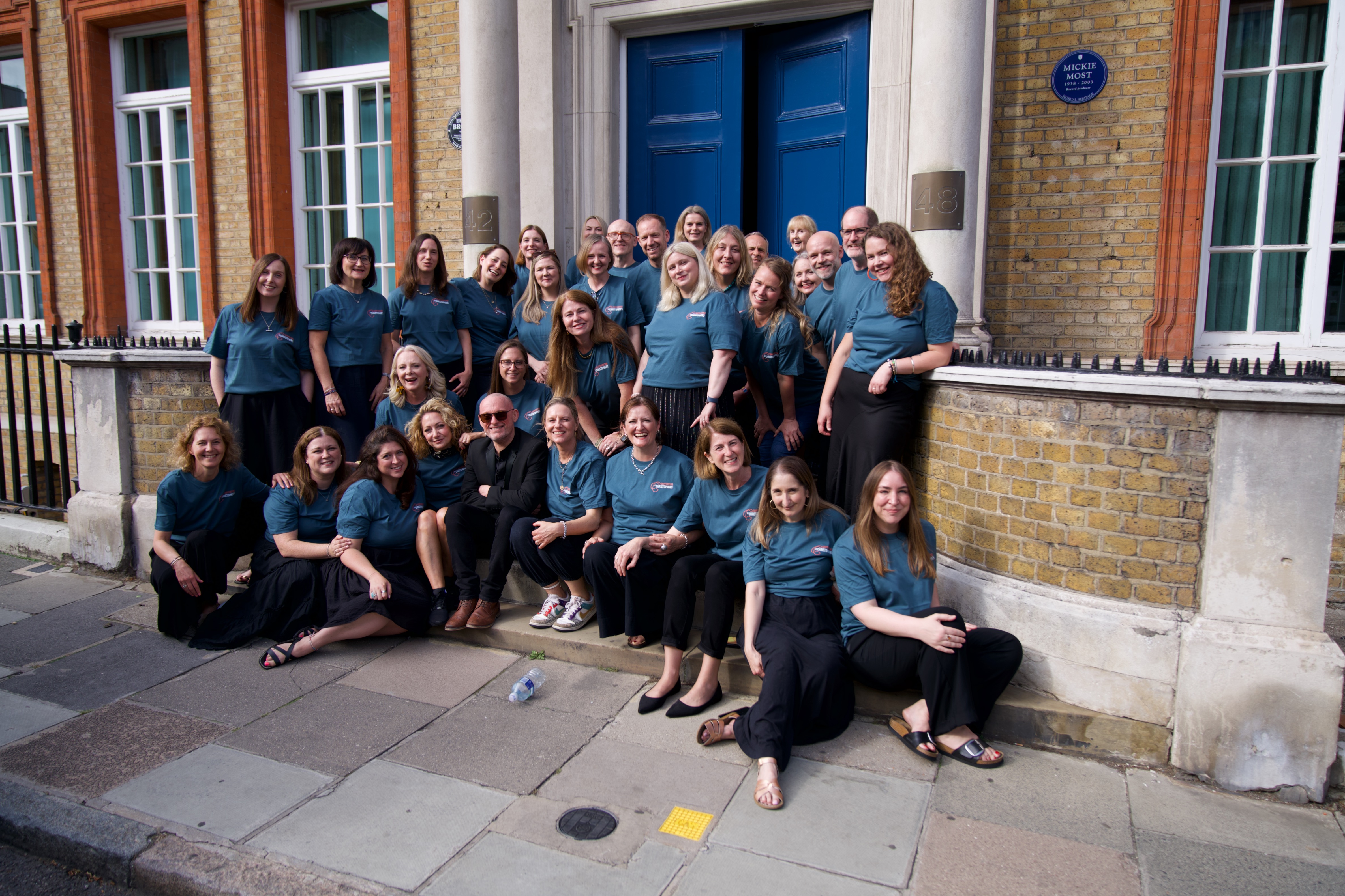 SLYMI choir members together after a performance