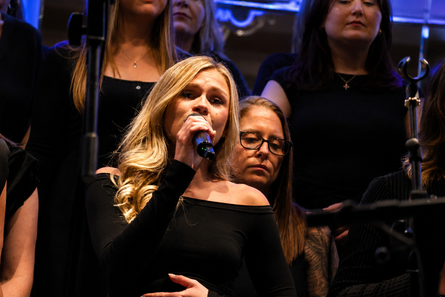 A SLYMI soloist performing with the choir